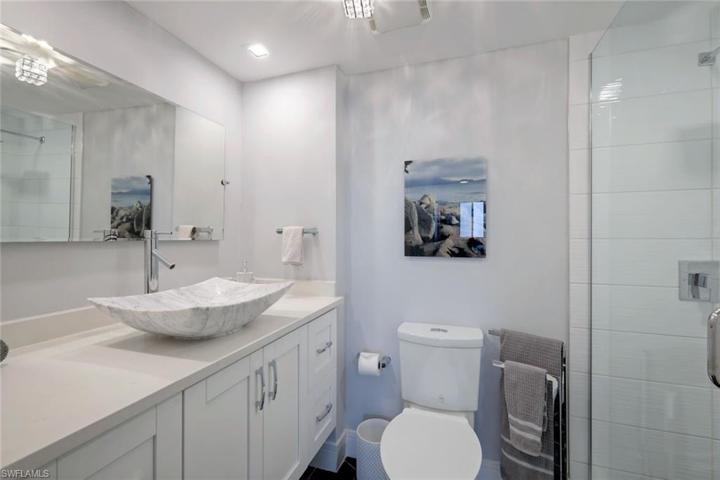 Beautifully updated guest bath with walk in shower and an abundance of counter/cabinet space.