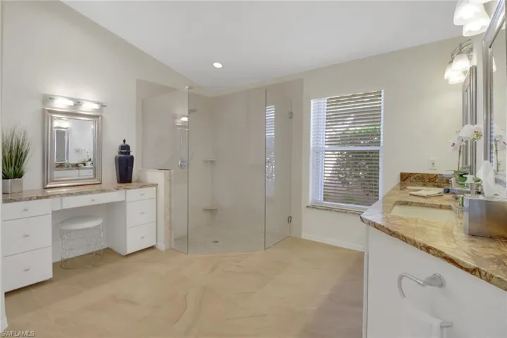 Bathroom with vanity and walk in shower
