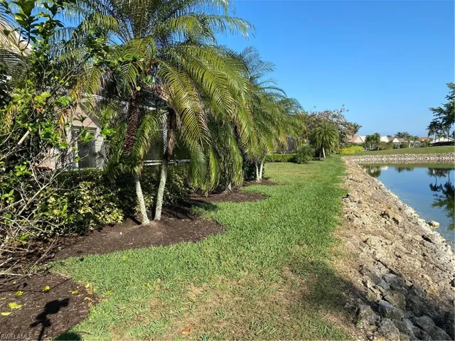 View of yard with a water view