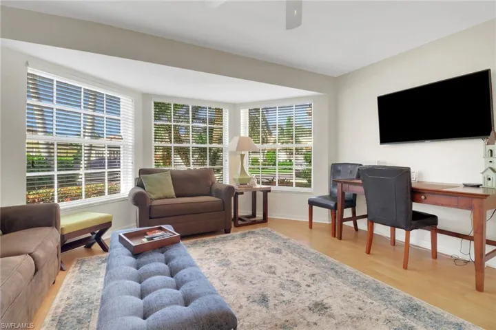 Living room featuring hardwood / wood-style floors and ceiling fan