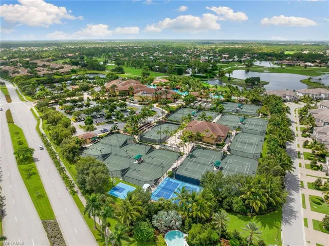 Birds eye view of property with a water view