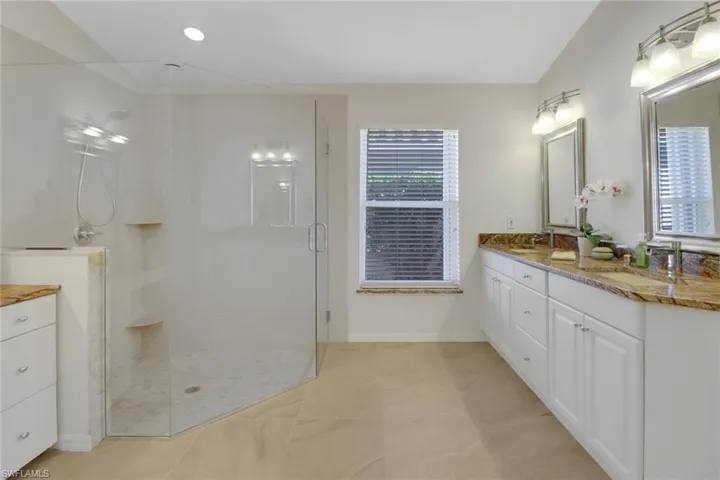 Bathroom with walk in shower and vanity