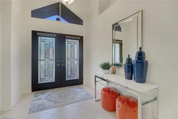 Tiled entryway with french doors