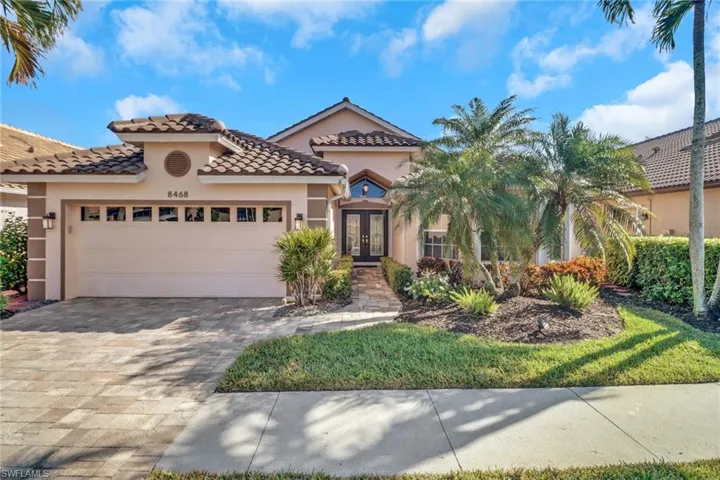 Mediterranean / spanish-style house featuring french doors and a garage