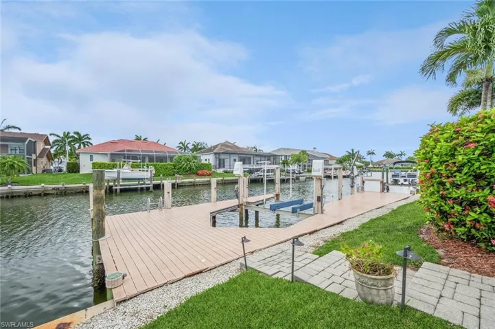 Dock area featuring a water view