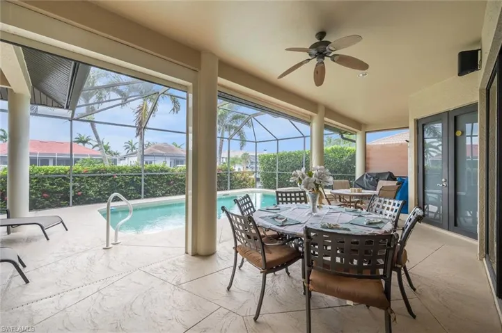 Sunroom featuring french doors, plenty of natural light, and ceiling fan