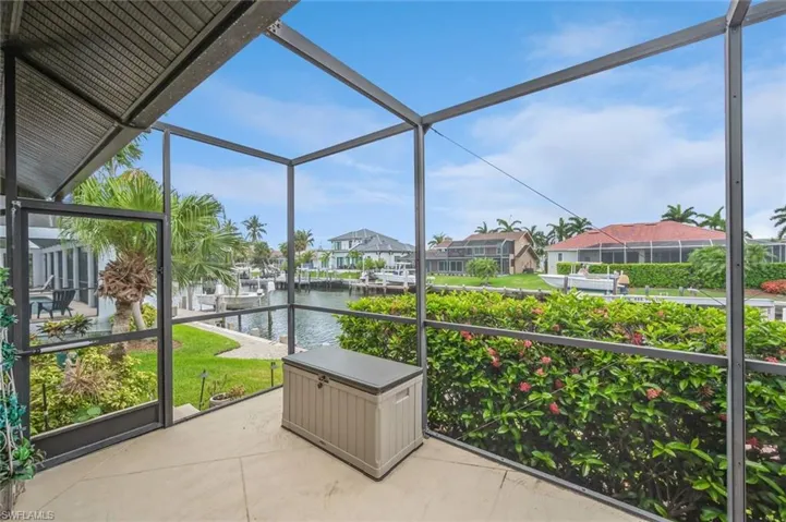 Unfurnished sunroom with a water view