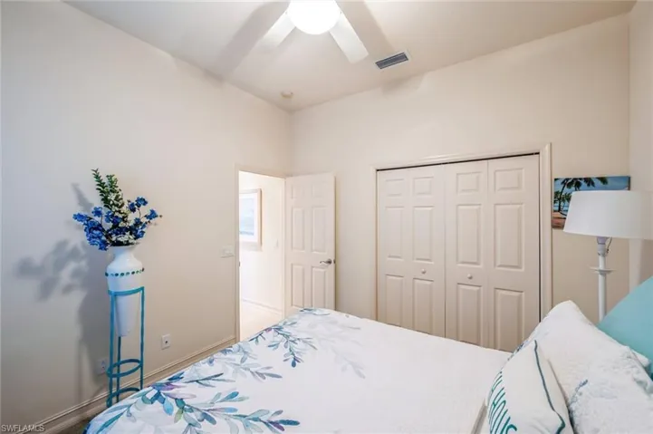 Bedroom with a closet and ceiling fan