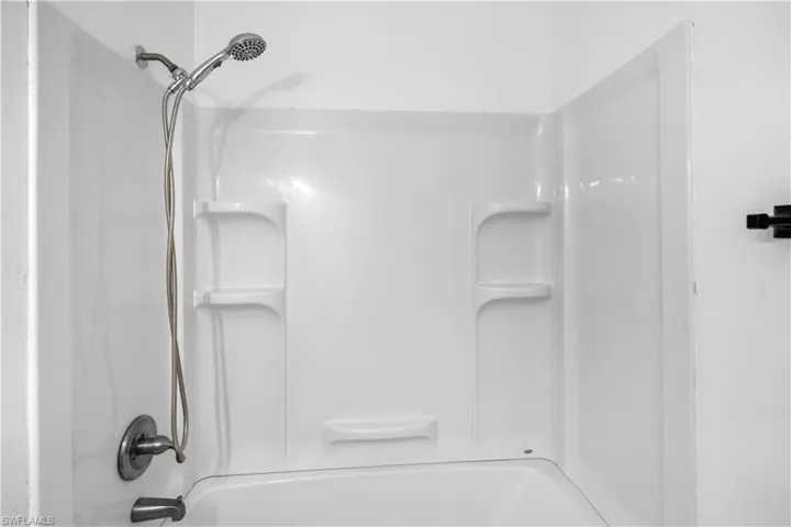 Full bath featuring bathing tub / shower combination