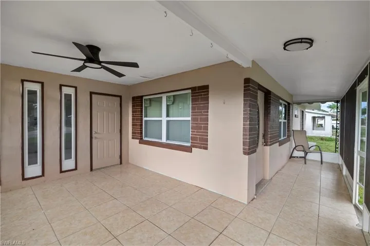 View of sun room terrace featuring ceiling fan