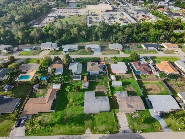 Aerial overview of property's location featuring nearby suburban area