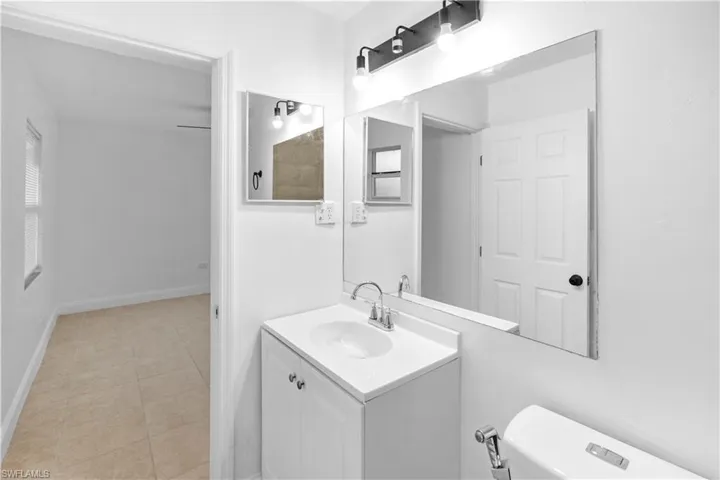 Bathroom with vanity and light tile patterned floors