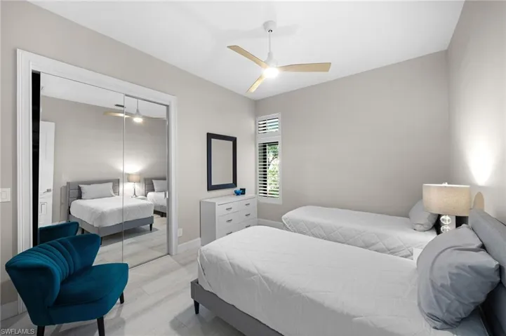 Bedroom featuring a closet, ceiling fan, and light hardwood / wood-style flooring