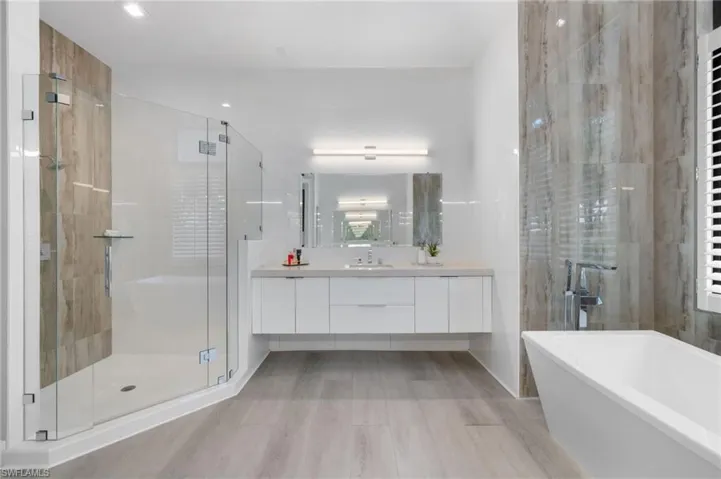 Bathroom with plus walk in shower and vanity