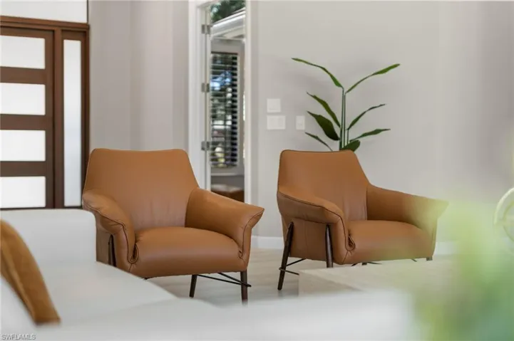 Sitting room with hardwood / wood-style flooring