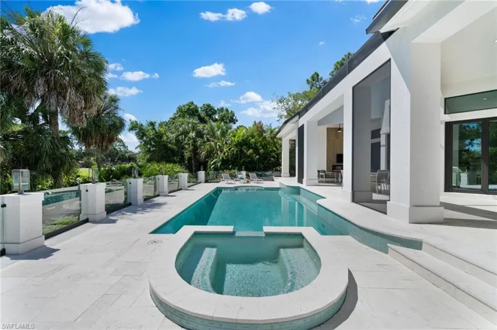 View of pool featuring an in ground hot tub and a patio area