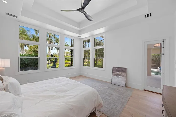 Primary Bedroom with door for pool access
