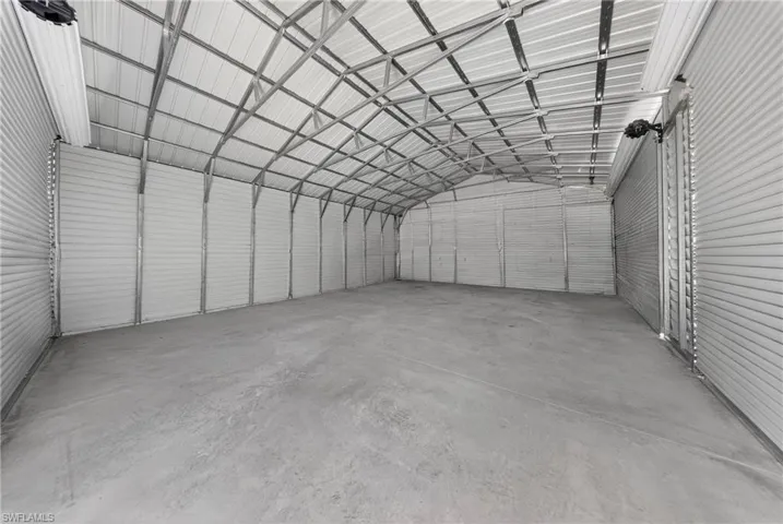 Garage featuring metal wall