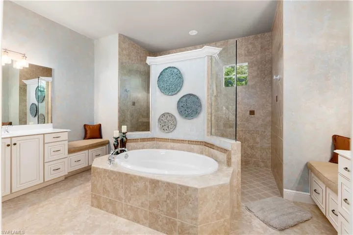 Primary bathroom with separate tub and shower