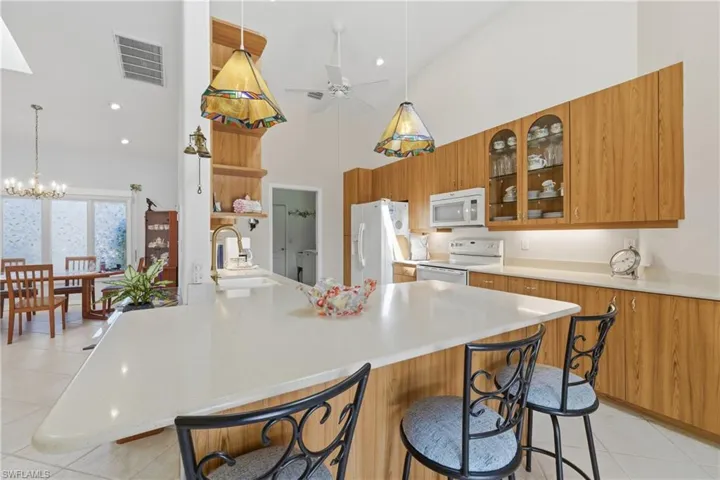 Handy Breakfast Bar + Cabinets galore