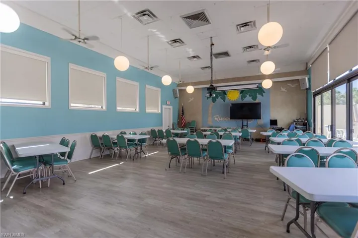 Dining area featuring visible vents and wood finished floors