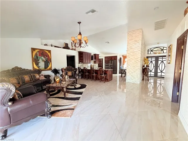 Living room featuring suspended lighting