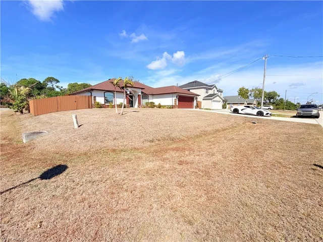Ranch-style house with a garage and driveway