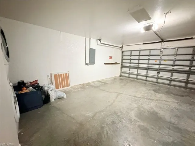 Garage featuring electric panel