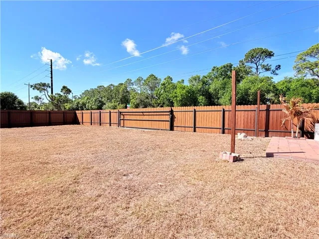 Fenced backyard featuring a patio