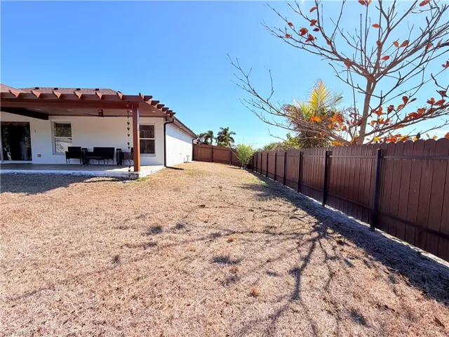Fenced backyard featuring a patio area