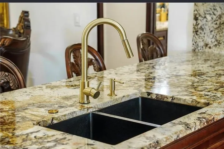Kitchen view of light stone counters