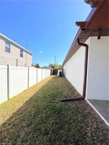 View of fenced backyard