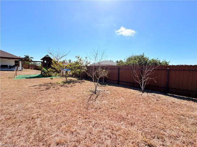 View of fenced backyard