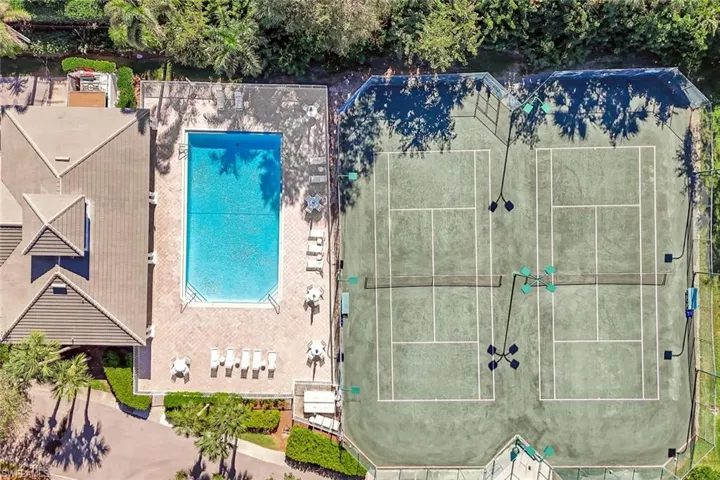 Main clubhouse with fitness room, year-round geothermal heated pool, and har-tru tennis courts