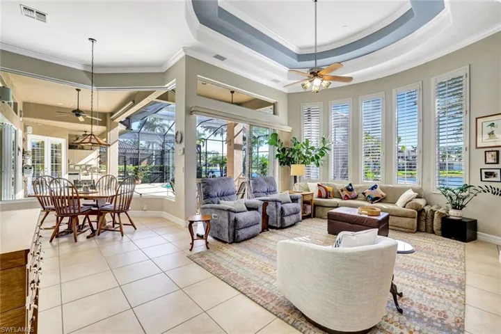 Family room and breakfast area with tile floors, and a wealth of natural light