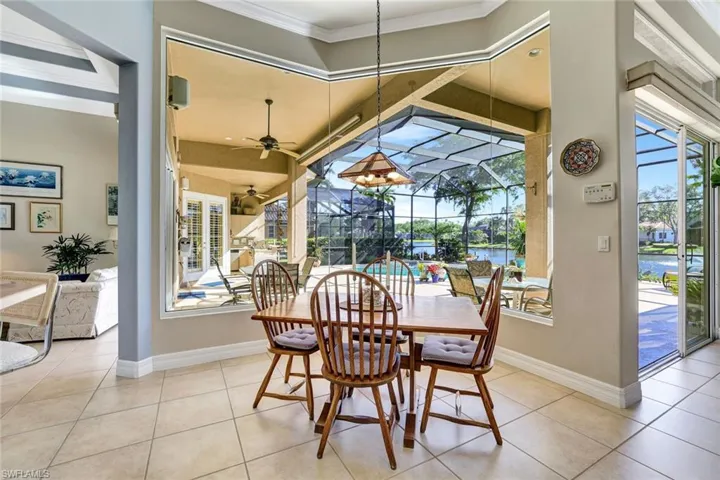 Breakfast area with tile floors and magnificent pool and lake view