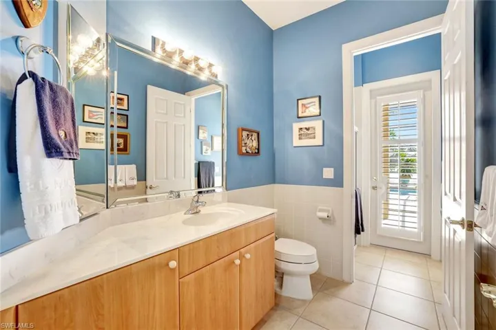 This is the cabana bathroom, which leads out to the pool.