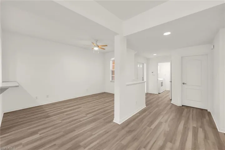 Spare room with a ceiling fan, light wood finished floors, and recessed lighting