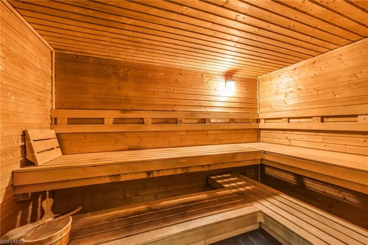 Relaxing sauna / steam room with wood ceiling and wood walls