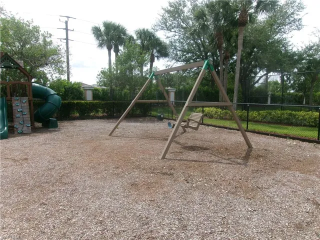 Community jungle gym featuring fence