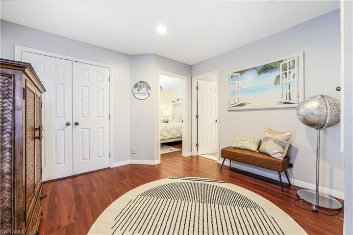 Second floor landing / loft area with ample closets and storage area and beautiful hardwood flooring