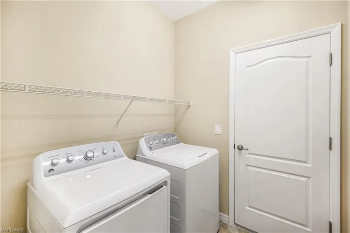 Laundry room with laundry area and washing machine and clothes dryer