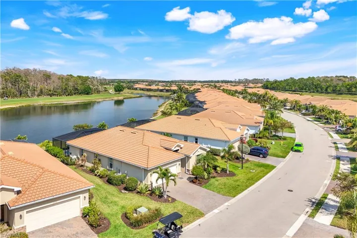 Aerial view featuring a water view and a residential view