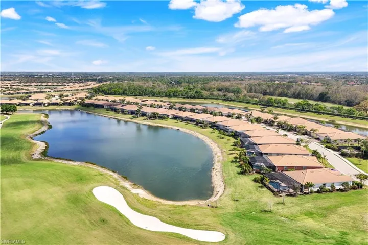Drone / aerial view with a water view and a residential view