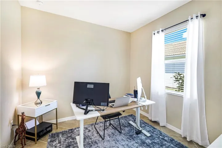 Office area or 4th bedroom  featuring tile patterned floors and baseboards