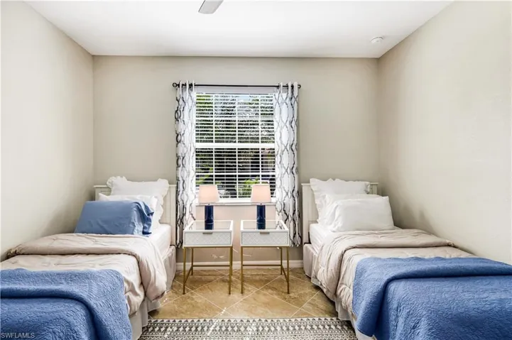 Third Bedroom featuring ceiling fan, baseboards, and light tile patterned flooring