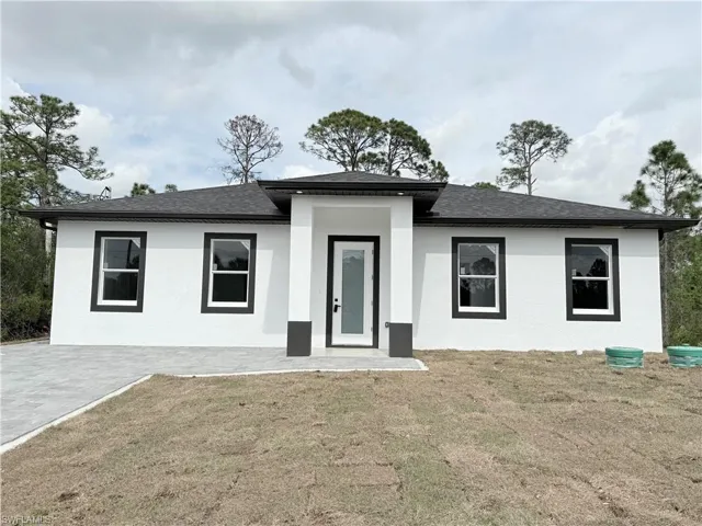 View of front of property with a front lawn