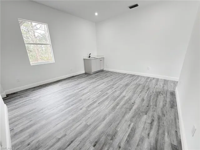 Unfurnished room with light hardwood / wood-style floors