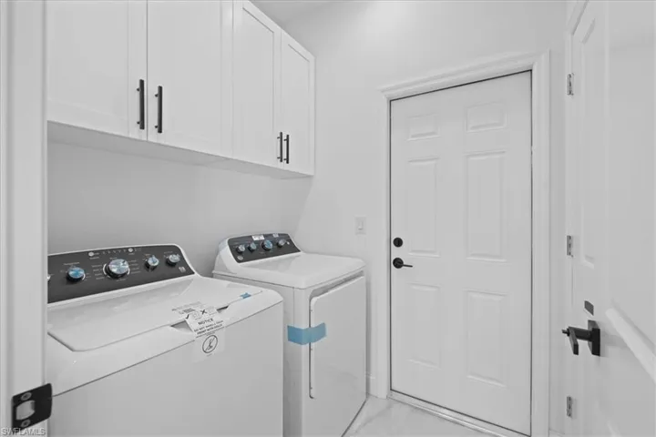 Laundry Room with cabinet closet and built-in closet, Washer and Dryer