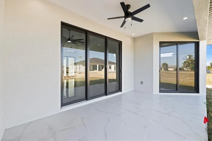 View of patio with a ceiling fan